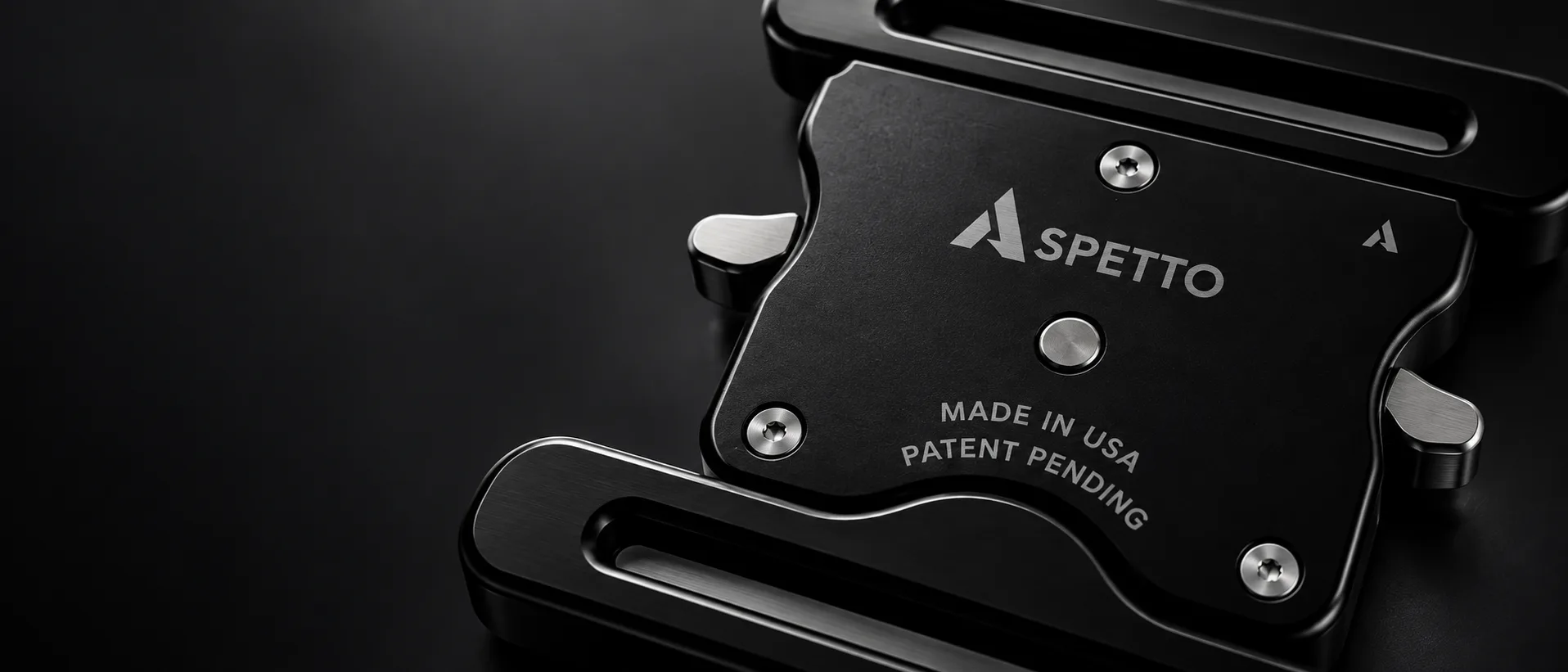 Close view of the CENTRO buckle, machined aluminum laser etched with the Aspetto mark